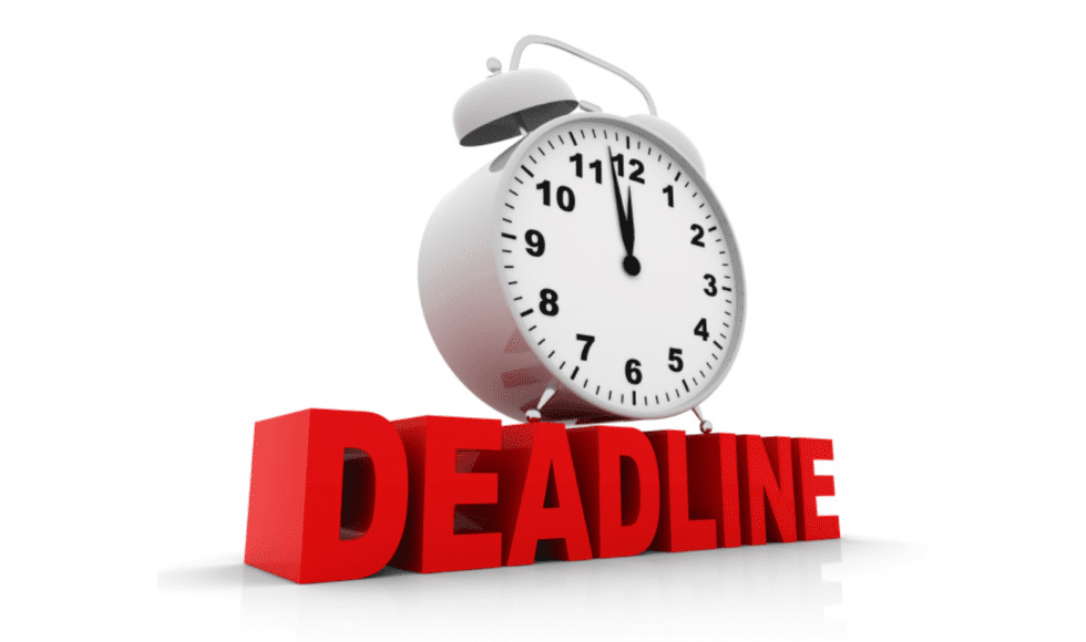 A clock showing midnight atop bold red letters spelling 'DEADLINE'.