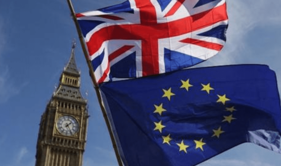 Union Jack and EU flags waving near Big Ben in London.