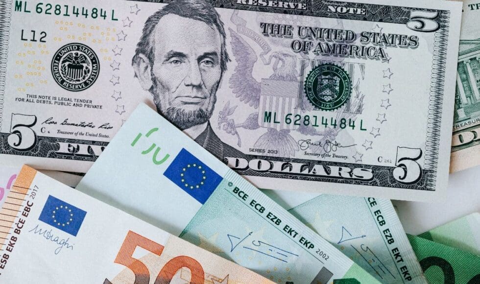 Various international banknotes including US dollars and euros.