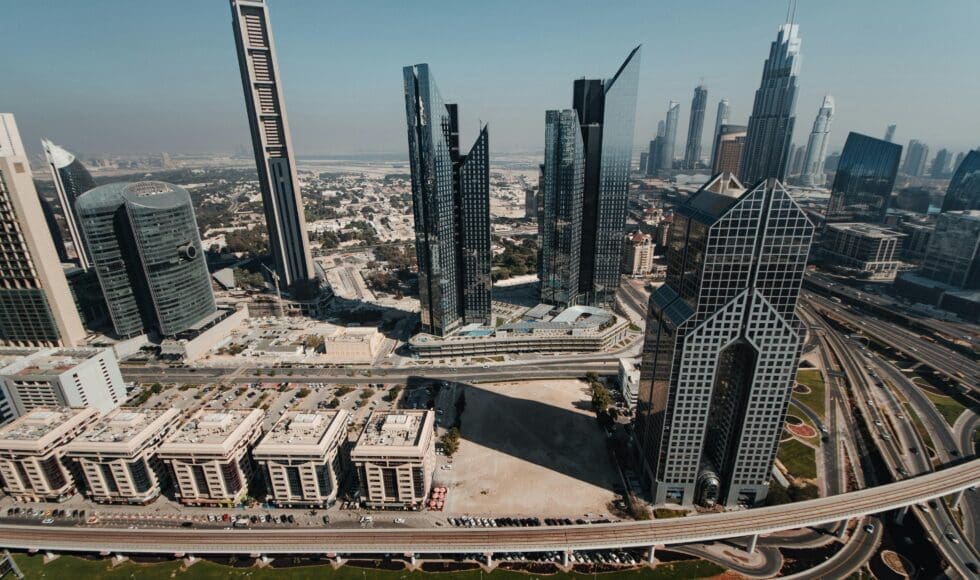 Aerial view of a modern cityscape with high-rise buildings under construction.